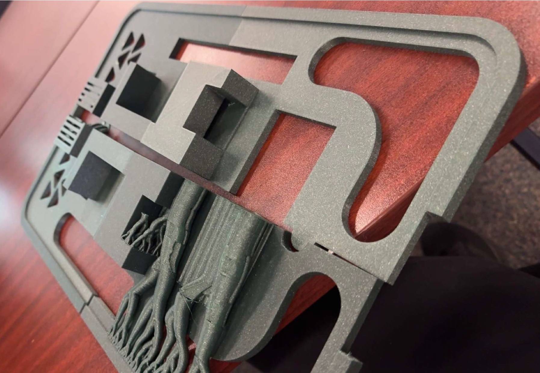 3D-printed frame sections laid out for test fit