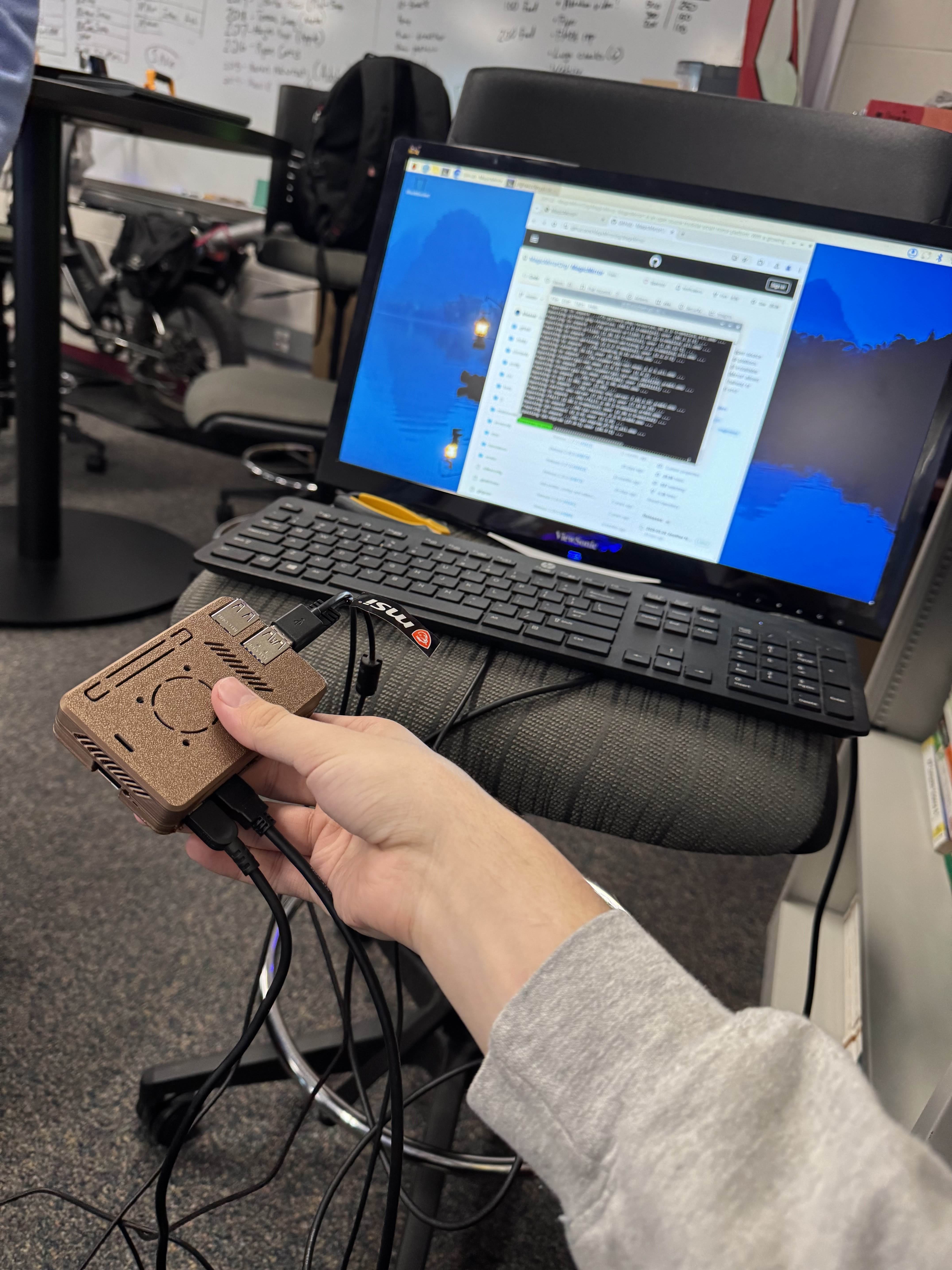 Raspberry Pi setup on desk with wiring during software install